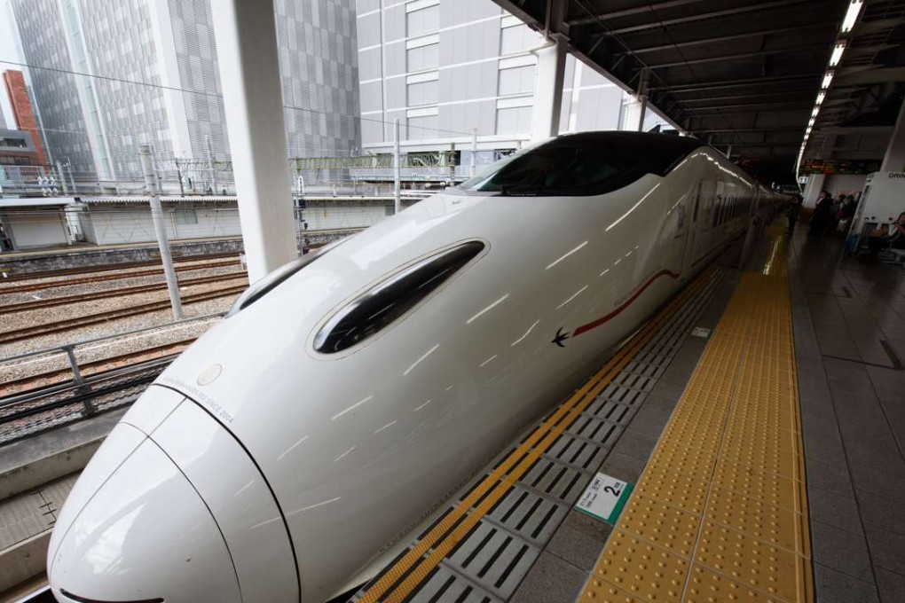 A Kyushu Railway Co. 800 series Shinkansen bullet train stops at Hakata Station in Fukuoka, Fukuoka Prefecture, Japan. Photo: Bloomberg