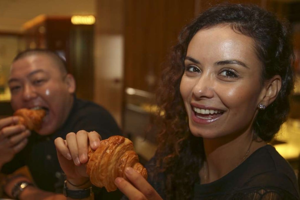 David Sung and Ines Gafsi taste croissants at the Mandarin Cake Shop in Central. Photo: Chen Xiaomei