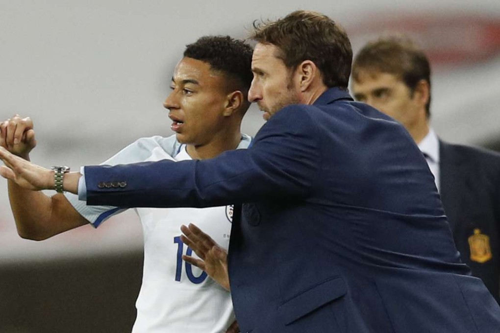 Gareth Southgate (right) with England's Jesse Lingard against Spain. Photo: Reuters