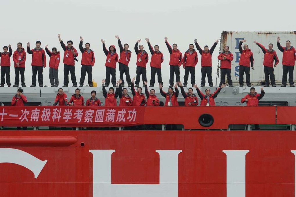 Chinese expendition team members aboard the polar research vessel Xue Long wave goodbye as they set sail from Shanghai. Photo: AFP