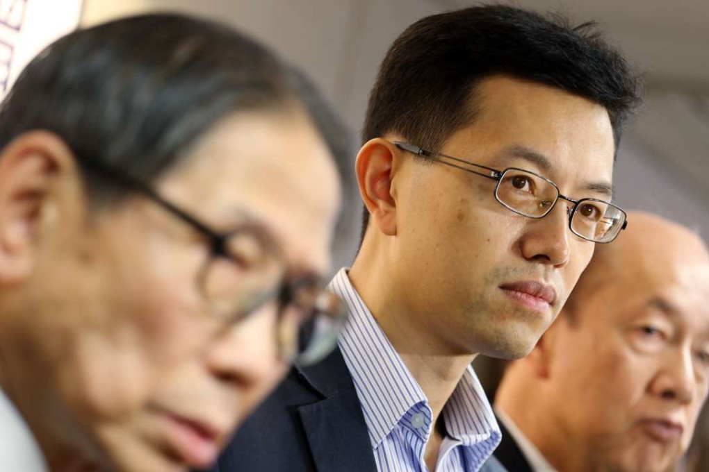 Standard Working Hours Committee member Stanley Ng Chau-pei (centre) said he hoped the committee would study their report. Photo: Felix Wong