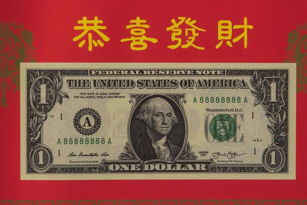 The Year of the Rooster 2017 dollar bill in honour of the Chinese Lunar New Year is introduced at the Bureau of Engraving and Printing in Washington, DC. Photo: AFP