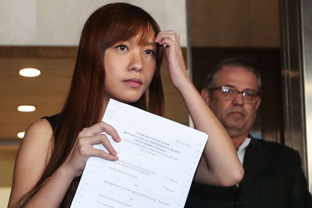 In his judgment on the government’s unprecedented bid to have Sixtus Baggio Leung Chung-hang and Yau Wai-ching disqualified, Mr Justice Thomas Au Hing-cheung said their conduct during the October 12 swearing-in ceremony meant they had declined to take their oaths and must therefore vacate their seats. Photo: Edward Wong