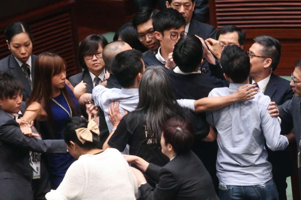 Yau Wai-ching (in a blue dress) and Sixtus Baggio Leung (centre, partially blocked) were stopped from retaking their oaths at a Legislative Council session earlier this month. Photo: K. Y. Cheng