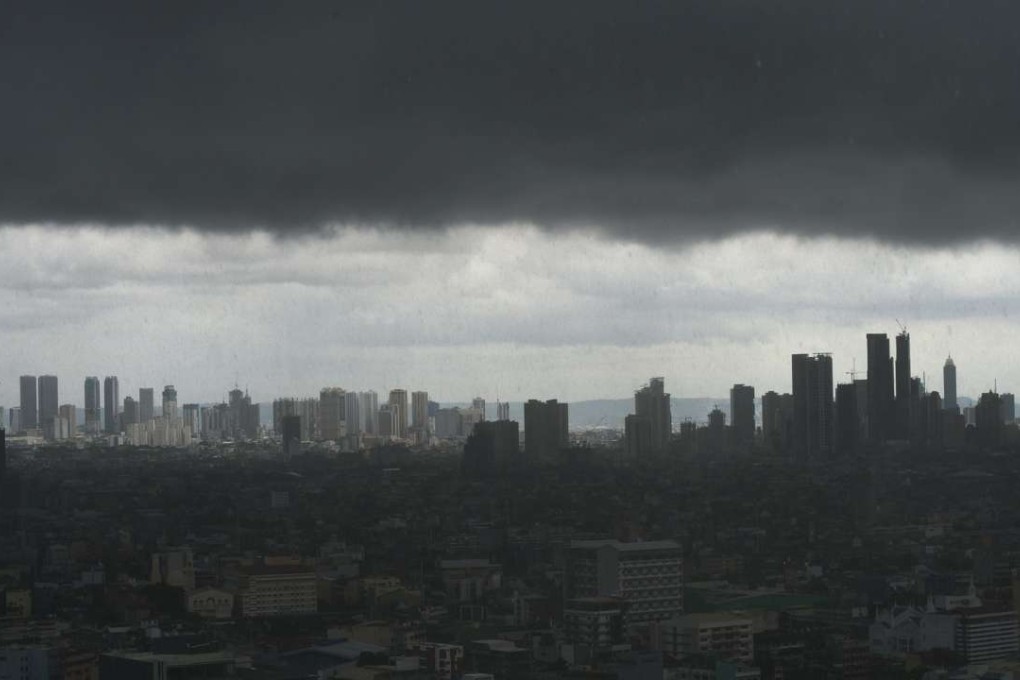 Dark storm clouds over the Manila skyline. Before Singapore, before Hong Kong, Manila was the undisputed centre of commerce in Asia Pacific. Photo: AFP