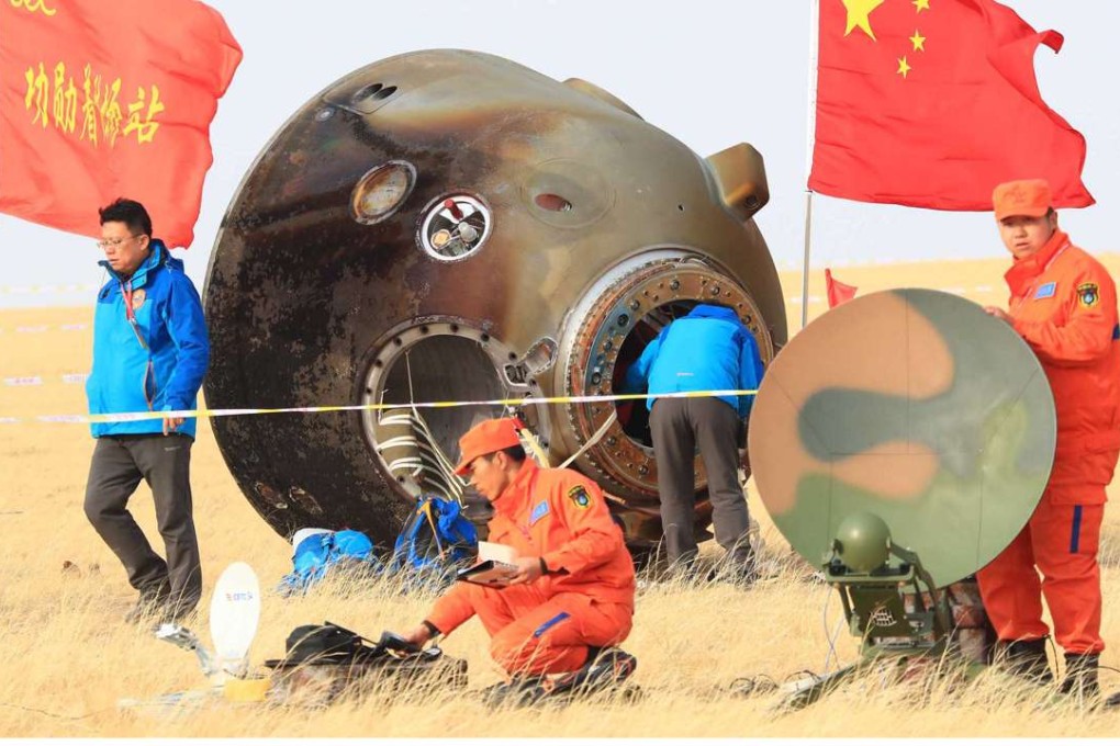 Technicians examine the Shenzhou-11 re-entry capsule in Inner Mongolia on Friday. Photo: Xinhua