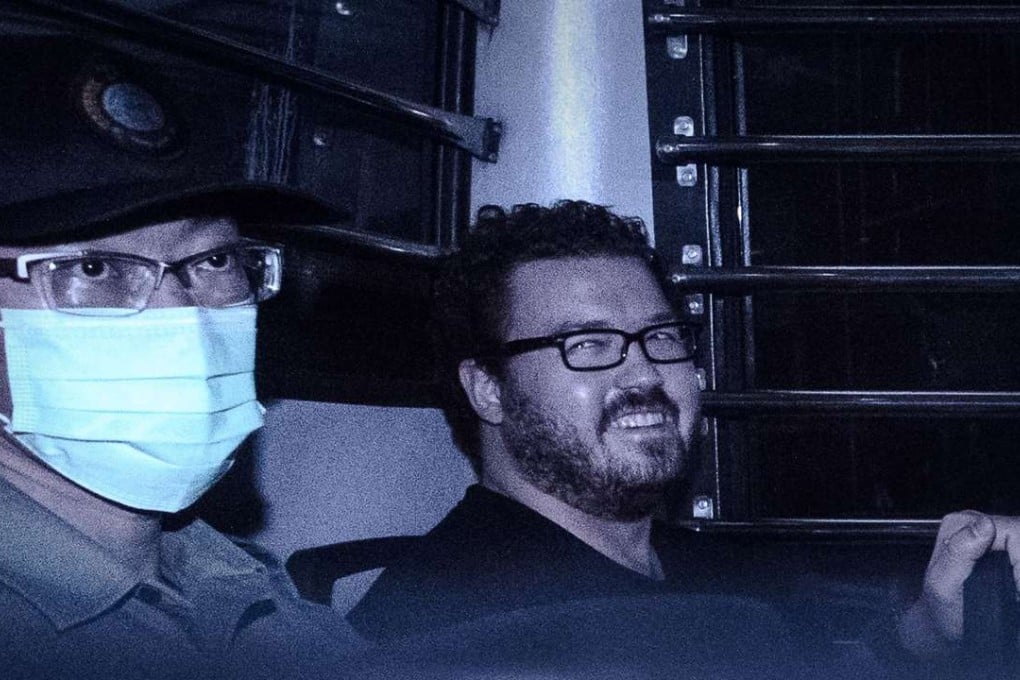 British banker Rurik Jutting smiles as he leaves court in Hong Kong. Photo: AFP