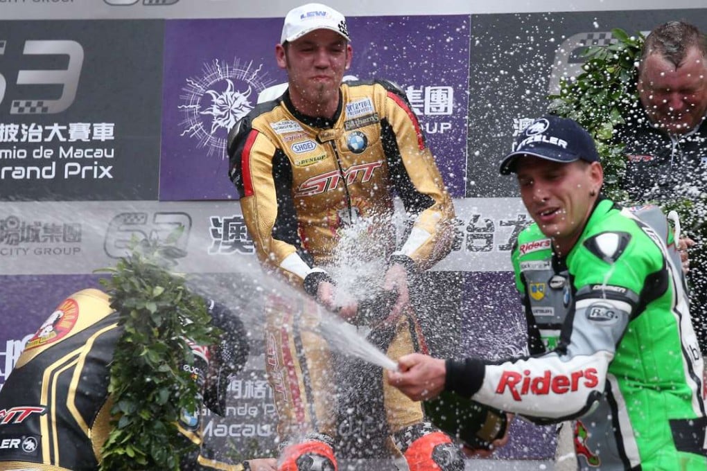 Peter Hickman (centre) celebrates on the poidum while Michael Rutter (left) gets sprayed by Martin Jessopp’s champagne on the podium at the end of the 50th Macau Motorcycle Grand Prix. Photos: K. Y. Cheng