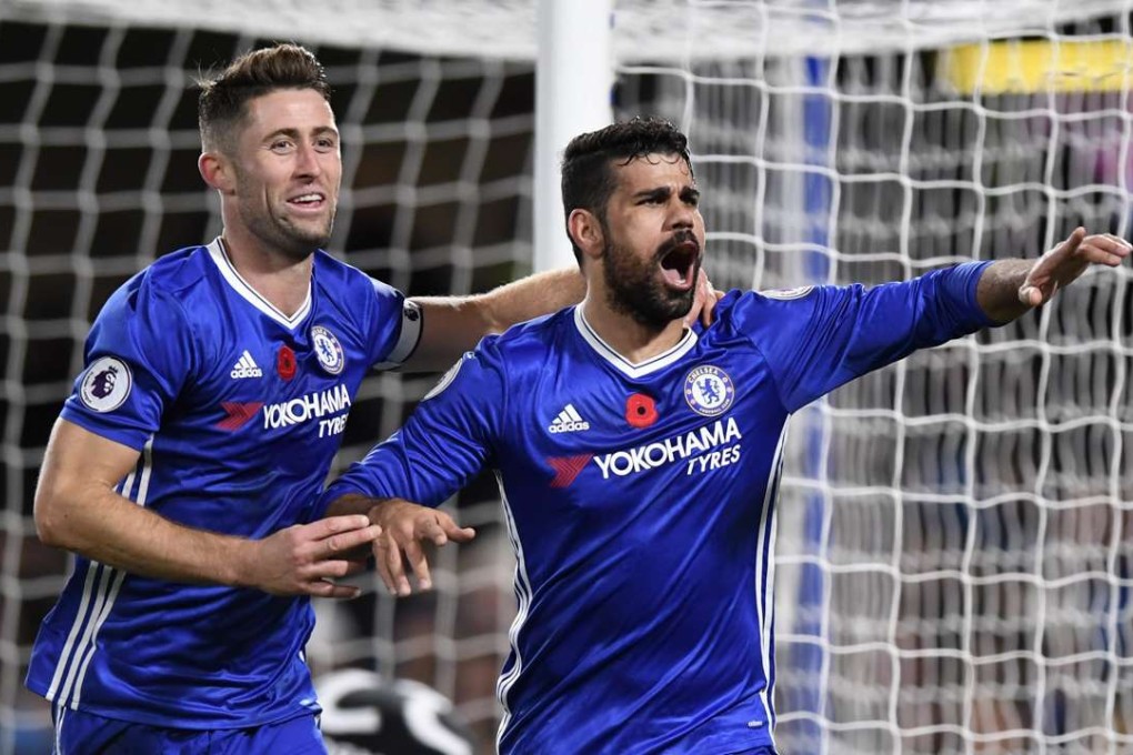 Chelsea's Diego Costa (R) is congratulated by teammate Gary Cahill after scoring against Everton EPA/WILL OLIVER