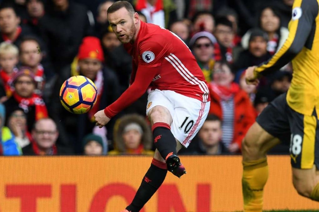 Wayne Rooney crosses for Manchester United in their 1-1 draw with Arsenal. Photo: AFP