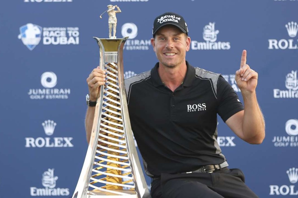 Henrik Stenson with the trophy after clinching the Race to Dubai money list at the DP World Tour Championship tournament. Photo: AP