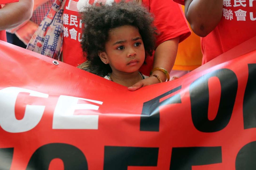 A child holding a banner during a rally in support of World Refugee Day 2016 in Central earlier this year. Photo: Edward Wong