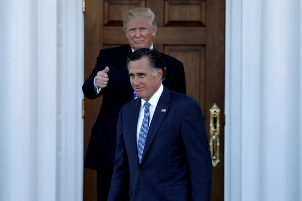 US President-elect Donald Trump gestures as former Massachusetts governor Mitt Romney exits their meeting at the main clubhouse at Trump National Golf Club. Photo: Reuters
