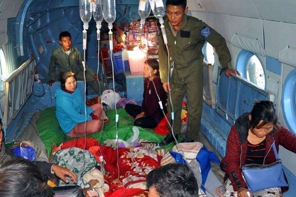 A Myanmar Military News showing soldiers helping wounded people on the military helicopter in Lashio, Shan State, northern Myanmar, on Sunday. Photo: EPA