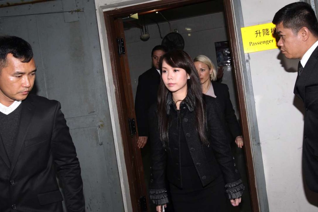 Yvonne Lui Lai-kwan (centre) who has two children with Chinese Estates chairman and chief executive Joseph Lau Luen-hung, appears at a court in Macau. The head of Chinese Estates Holdings, Joseph Lau, and Hong Kong businessman Steven Lo have both been sentenced to more than five years in prison after being convicted by a Macau court of corruption. 14MAR14
