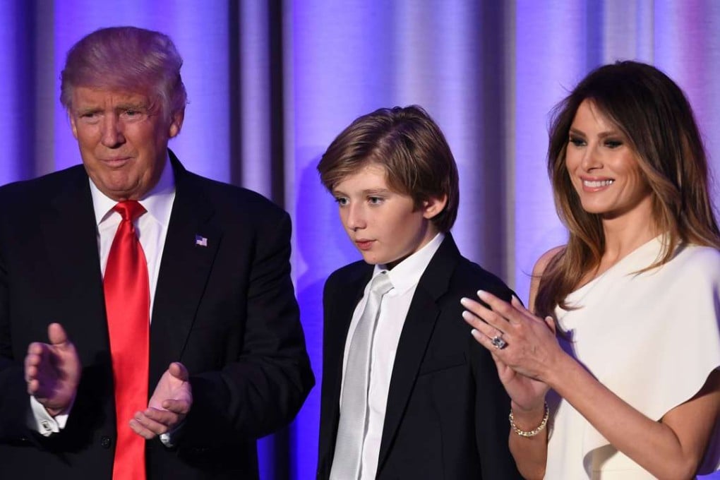 US President-elect Donald Trump arrives with his son Barron and wife Melania at the New York Hilton Midtown in New York in the early hours of November 9. Melania and Barron will stay in New York when the president-elect moves into the White House, the transition team has confirmed. Photo: AFP