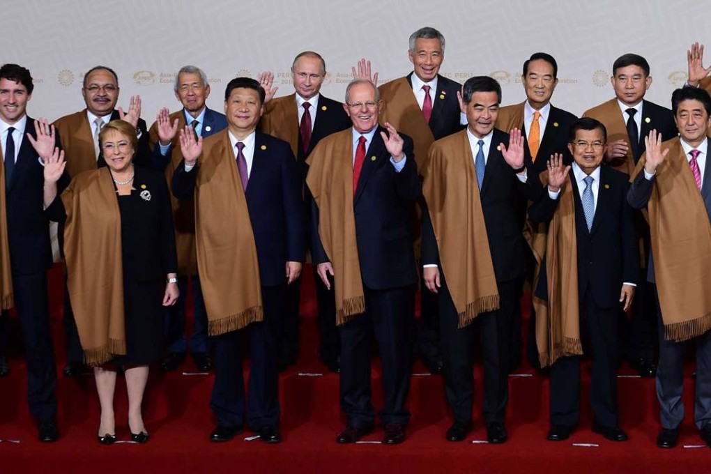 Leaders don traditional Peruvian garb for the traditional family photo at the end of the APEC summit in Lima on Sunday. Photo: AFP