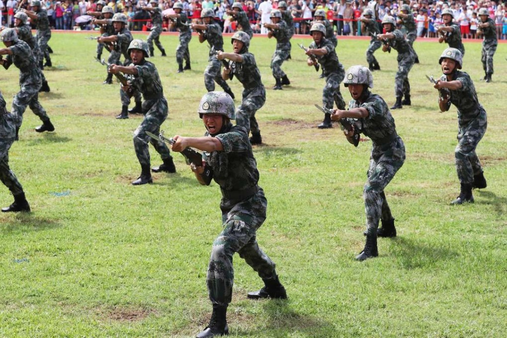 PLA soldiers put on a display for the public at the Stonecutters Island barracks on July 1 to mark the 19th anniversary of the establishment of the Hong Kong Special Administrative Region. Photo: Edward Wong