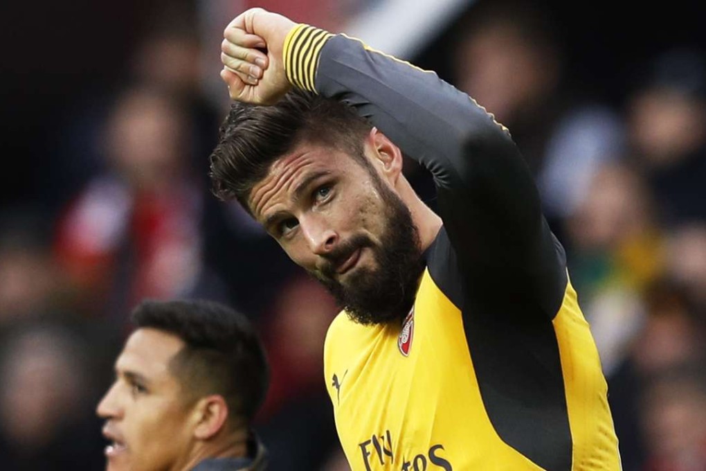 Olivier Giroud celebrates scoring for Arsenal against Manchester United. Photos: Reuters