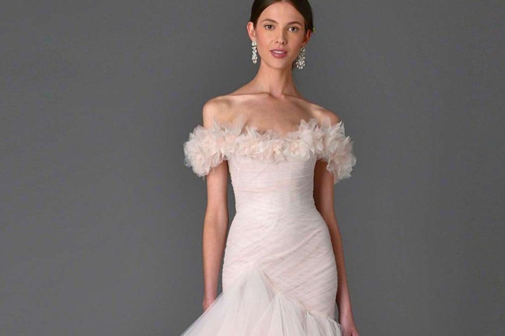 An off-the-shoulder gown by Marchesaok at Central Weddings.