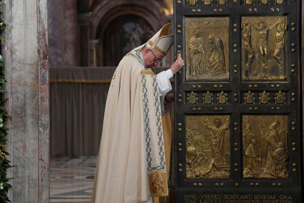 Pope Francis closes the Holy Door to mark the closing of the Catholic Jubilee year of mercy at the in Saint Peter's Basilica at the Vatican on Sunday. Photo: Reuters