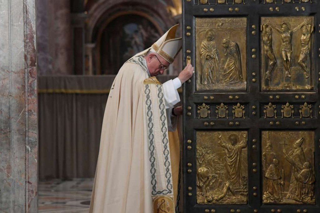 Pope Francis closes the Holy Door to mark the closing of the Catholic Jubilee year of mercy at the in Saint Peter's Basilica at the Vatican. Photo: Reuters