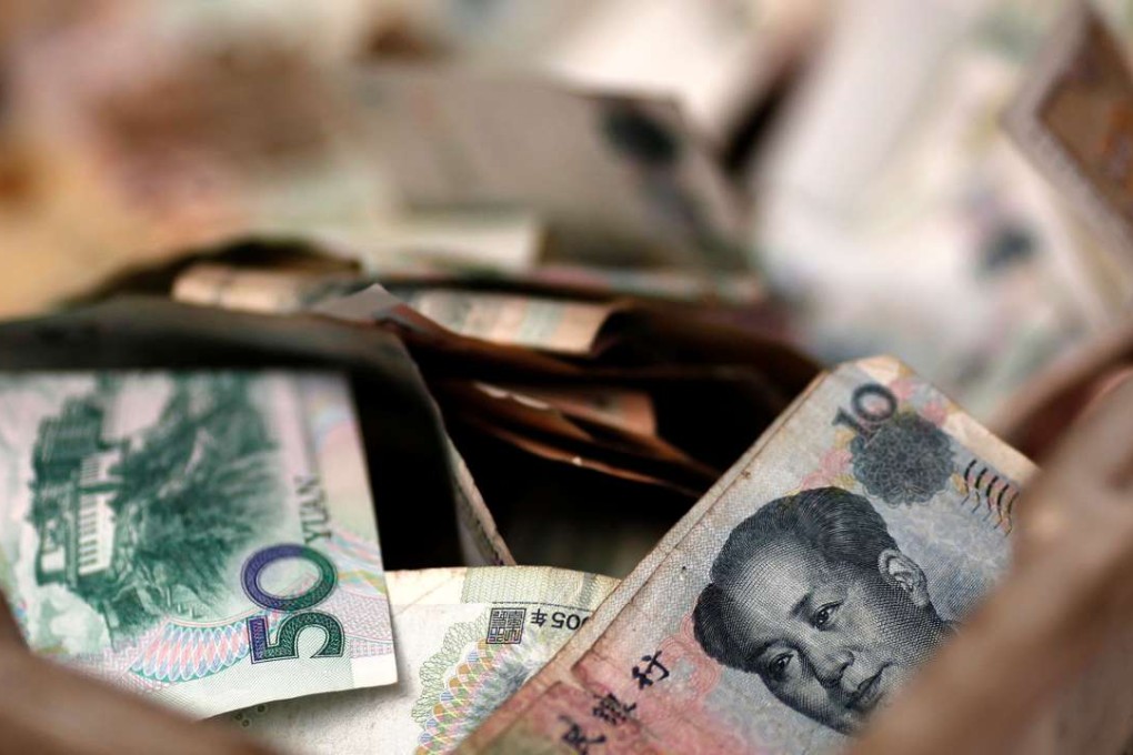 China’s currency has fallen to its lowest value against the dollar in eight years. Photo: Reuters