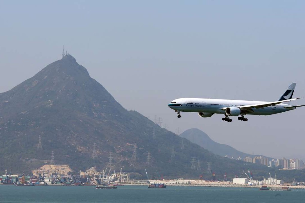 A Cathay Pacific flight lands at Hong Kong International Airport. Photo: K. Y. Cheng