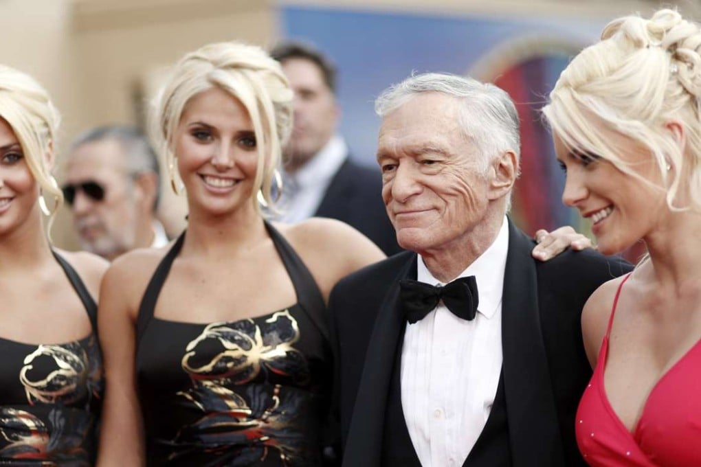 Identical twins Karissa and Kristina Shannon, Hugh Hefner and Crystal Harris arrive at the taping of the American Film Institute Life Achievement Awards in Culver City, Californiam in 2009. Photo: AP