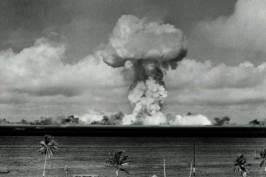 The mushroom cloud of an atom bomb rises among abandoned ships in Bikini lagoon, Marshall Islands, on July 1, 1946. Photo: AP