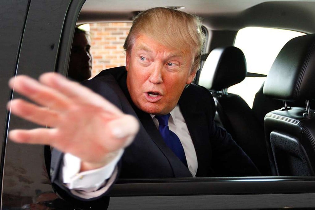 Donald Trump waves as he leaves a business expo at the Radisson Hotel in New Hampshire, in 2011. Trump has a property and hotel empire that is inevitably exposed to US government policy. In other words, his future decisions as president could directly affect his own businesses’ profitability. Photo: Reuters