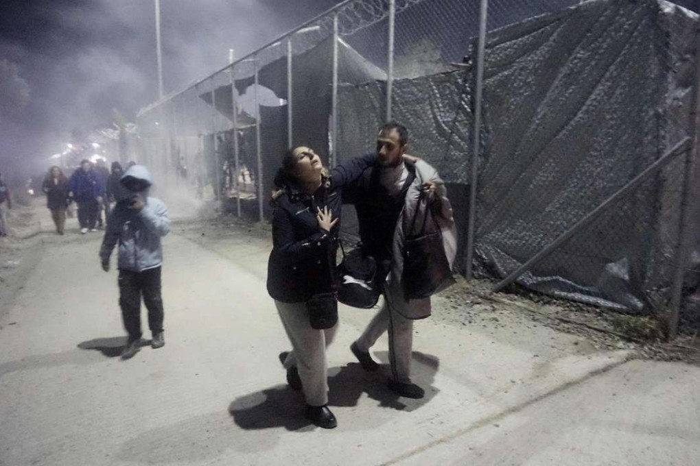 Migrants leave Moria camp following an explosion and fire on the island of Lesbos early on Friday. Photo: AFP