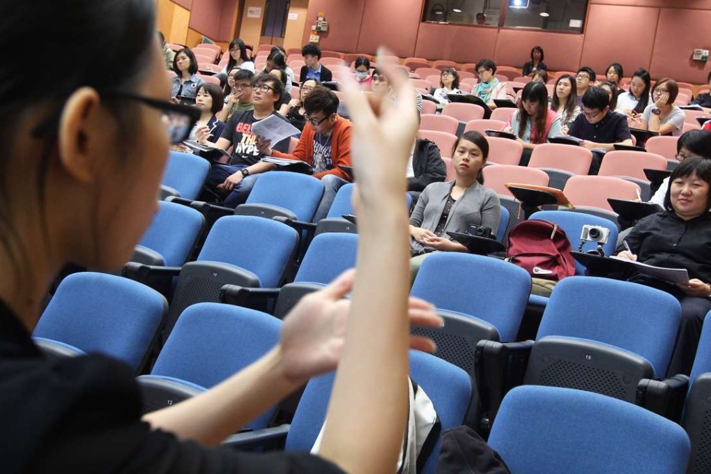 Two hearing-impaired students attend a lecture in 2013 at the then Hong Kong Institute of Education (now renamed Education University), studying for a bachelor’s degree in special needs education. Photo: Jonathan Wong