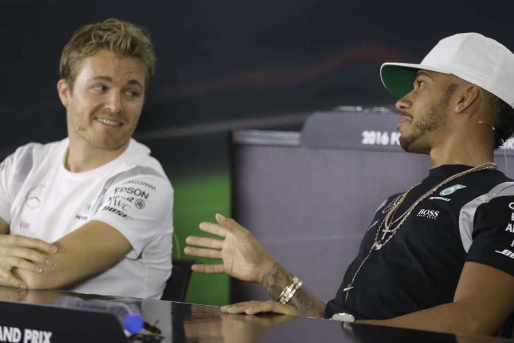 Mercedes drivers Lewis Hamilton and Nico Rosberg discuss the pit crew swap at a press conference ahead of practice for Sunday’s Abu Dhabi Grand Prix. Photo: AP