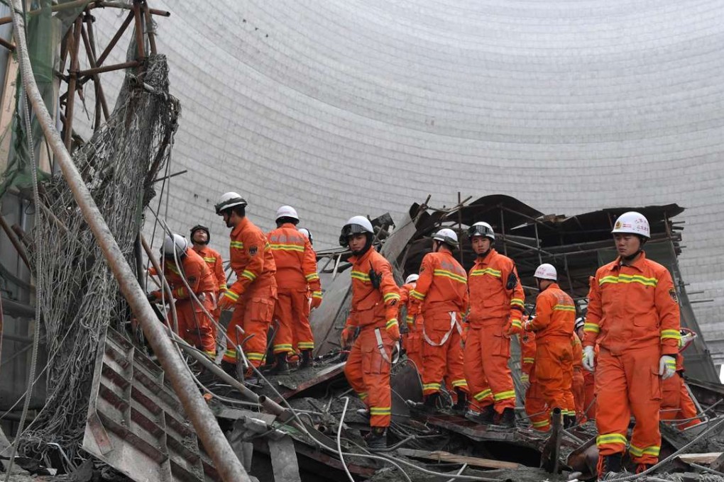 Rescue workers at the scene of the disaster. Photo: EPA