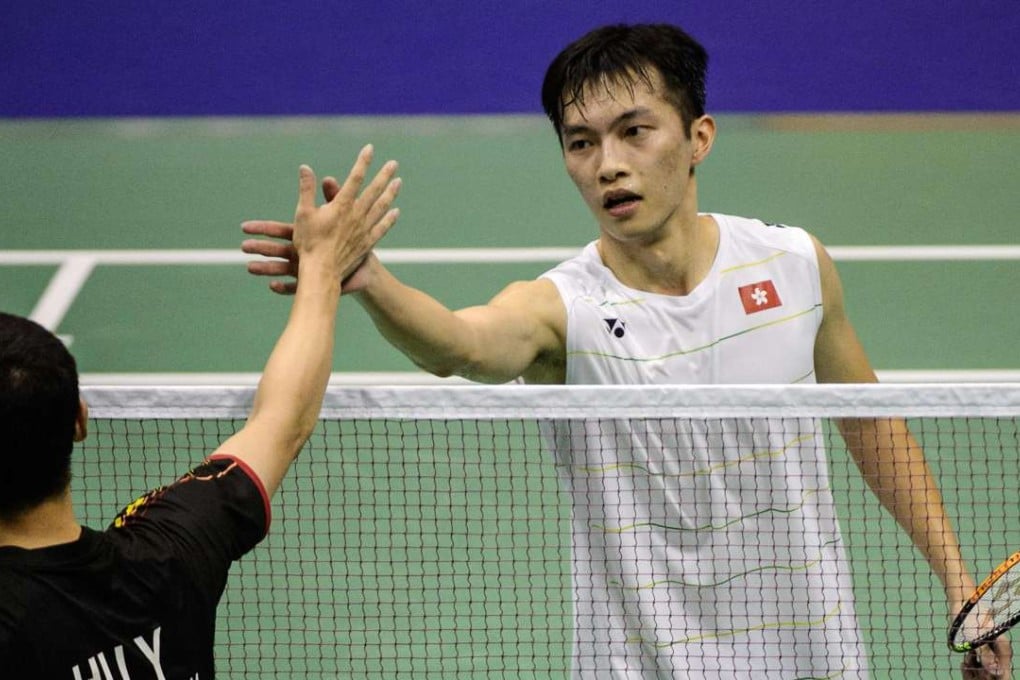 Hong Kong's Angus Ng Ka-long (right) shakes hands with compatriot Hu Yun after winning his semi-final. Photo: AFP