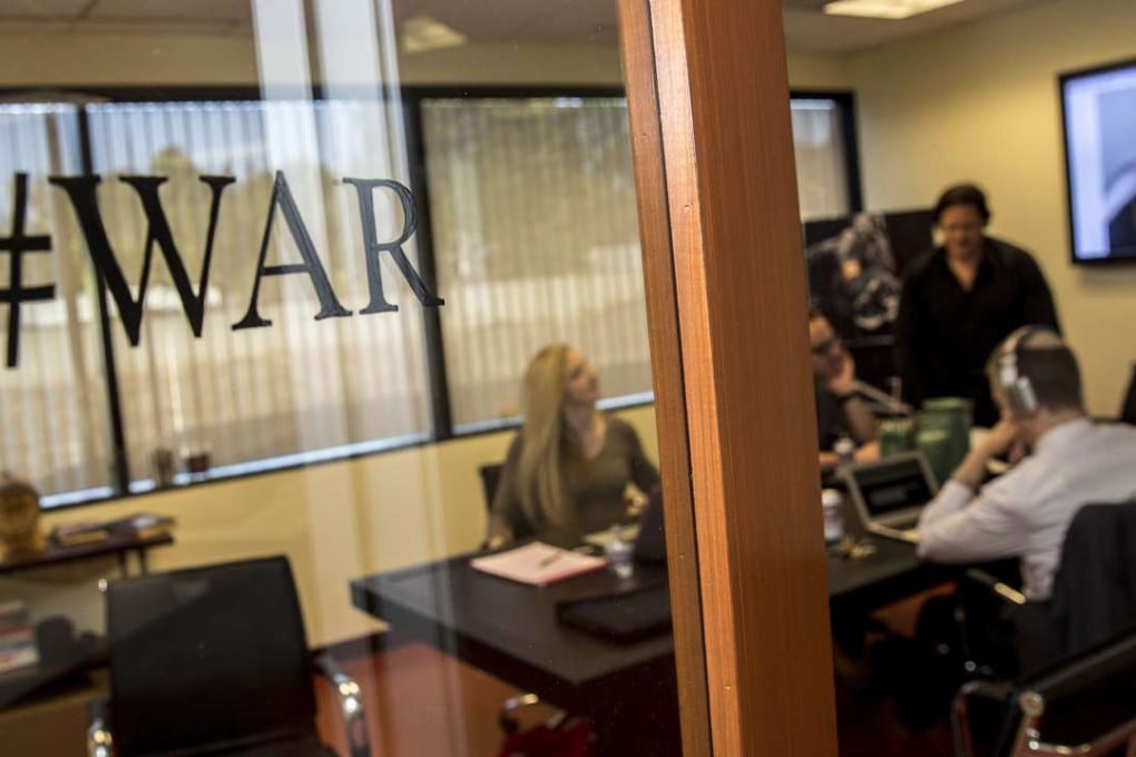 Breitbart News staff members congregate in the conference room of the company’s offices in Los Angeles. Photo: TNS
