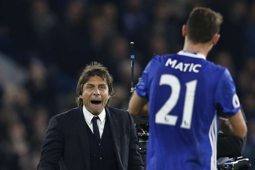 Chelsea manager Antonio Conte celebrates after the game with Nemanja Matic. Photo: Reuters