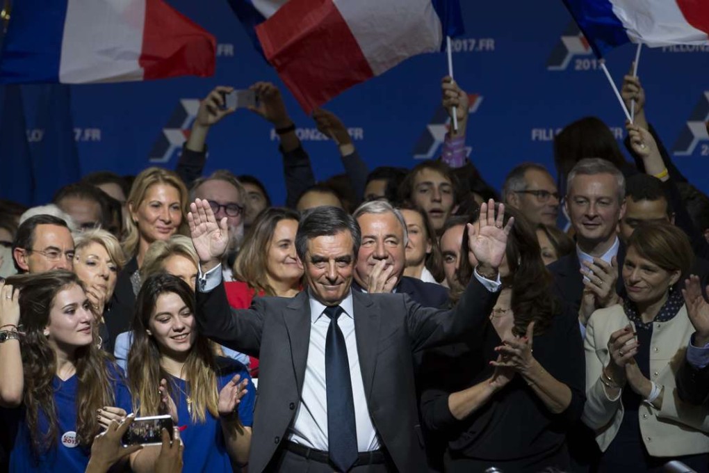epa05650150 (FILE) A file photograph showing candidate for the right-wing Les Republicains (LR) party primaries ahead of the 2017 presidential election and former French Prime Minister, Francois Fillon waves during a political rally of the second round of the rightwing presidential primary, in Paris, France, 25 November 2016. Media reports that Francois Fillon has won the second round on 27 November 2016 beating opponent Alain Juppe. EPA/IAN LANGSDON
