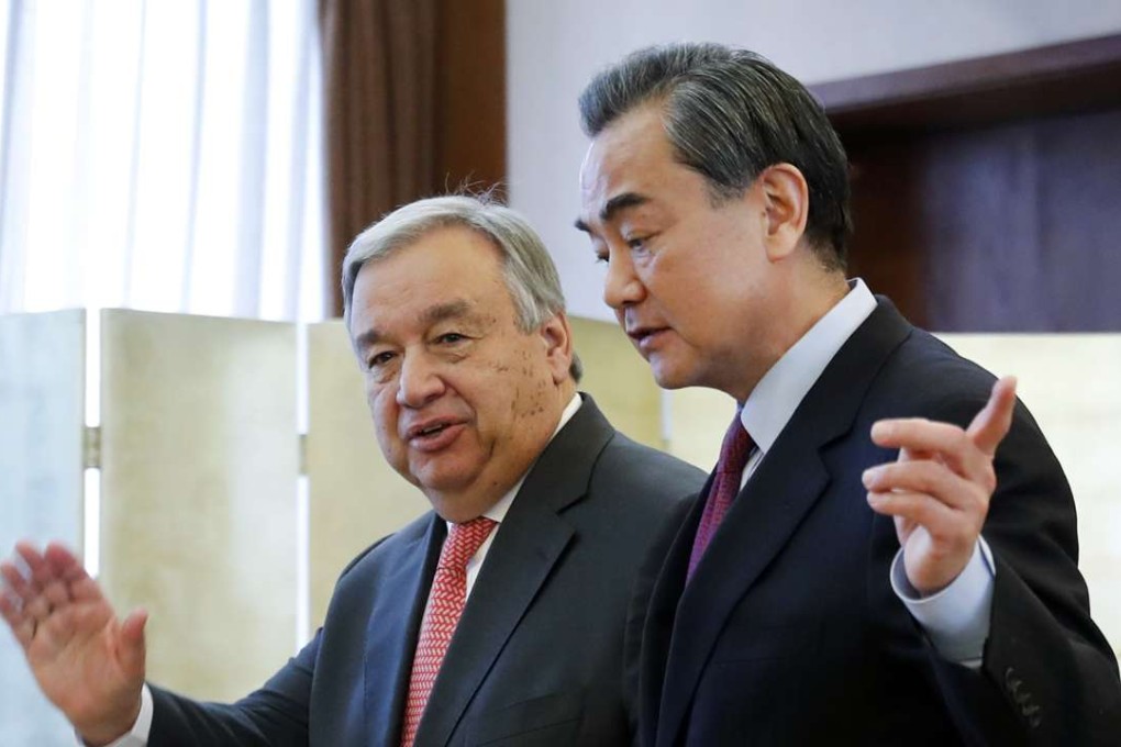 Incoming UN chief Antonio Guterres (left) with Foreign Minister Wang Yi in Beijing. Photo: AP