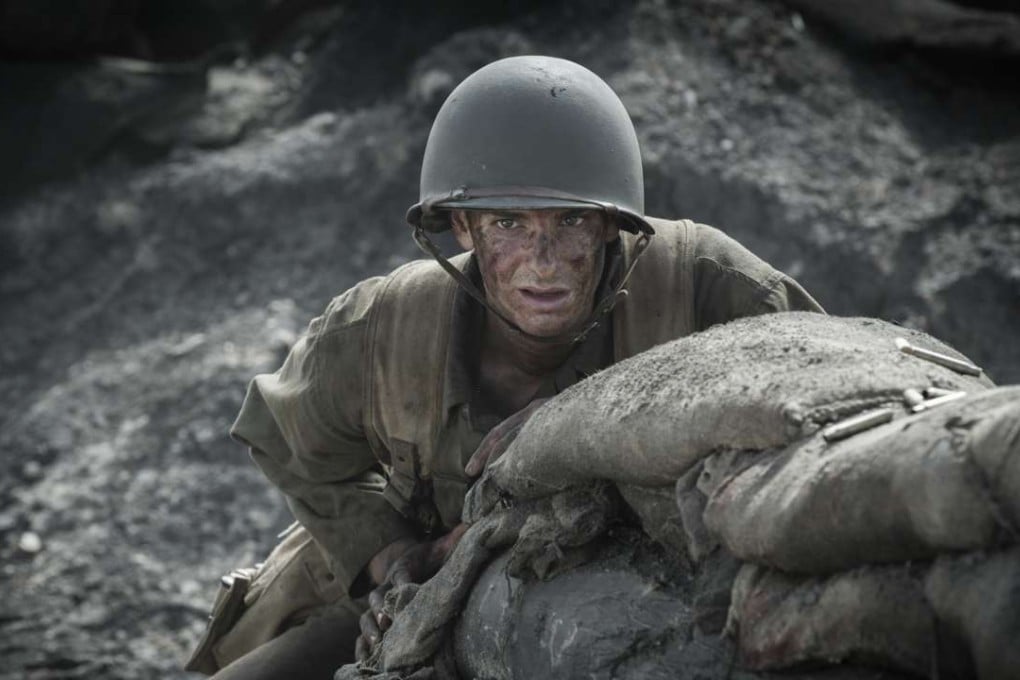 Andrew Garfield as Desmond Doss in Hacksaw Ridge (category IIB), directed by Mel Gibson. The film also stars Sam Worthington and Luke Bracey.
