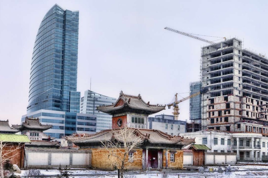 Modern building projects surround the famous Choijin Lama temple representing the heart of the old city of Ulaanbaatar. Photo: Hamid Sardar