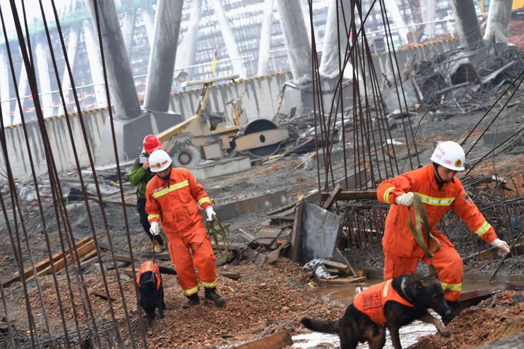Rescue workers search through the remains of a collapsed platform in a cooling tower at the power station in Fengcheng. Photo: AFP