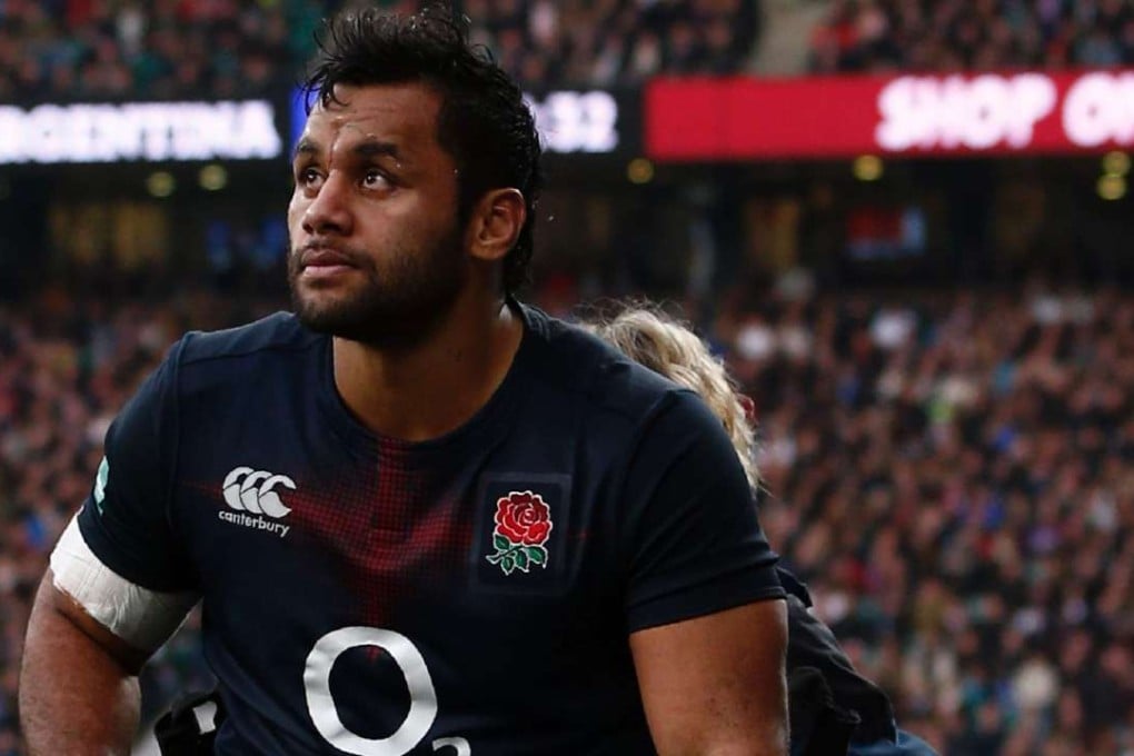 England number eight Billy Vunipola is helped from the field against Argentina at Twickenham. Photo: AFP
