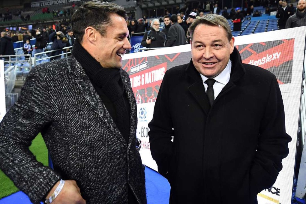 Former All Black Dan Carter (left) speaks with coach Steve Hansen at the Stade de France. Photo: AFP