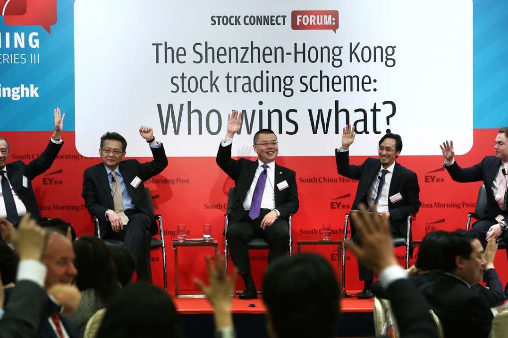Participants raise their hands at the recent Redefining Hong Kong Debate Series 3, ‘The Shenzhen-Hong Kong stock trading scheme: Who Wins What?’ forum. Photo: Jonathan Wong