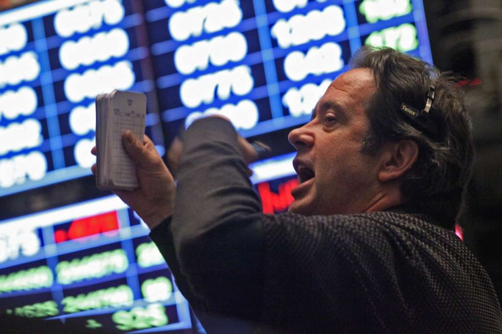 A trader works on the floor of the Chicago Board of Trade. Photo: Bloomberg