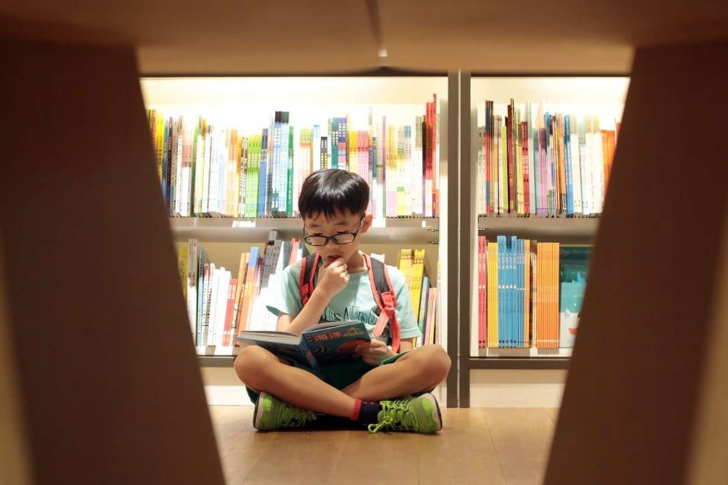 An engrossed young reader at the Eslite Spectrum bookstore at Star House in Tsim Sha Tsui on October 2 last year. Visitors can also buy refreshments, jewellery, arts and crafts, handbags, skincare and organic products. Photo: Bruce Yan