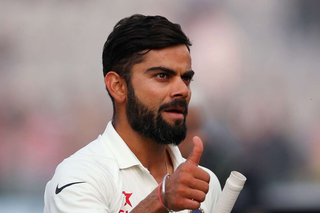 Job well done again: India skipper Virat Kohli keeps it low-key as he celebrates beating England in the third test in Mohali. Photo: Reuters