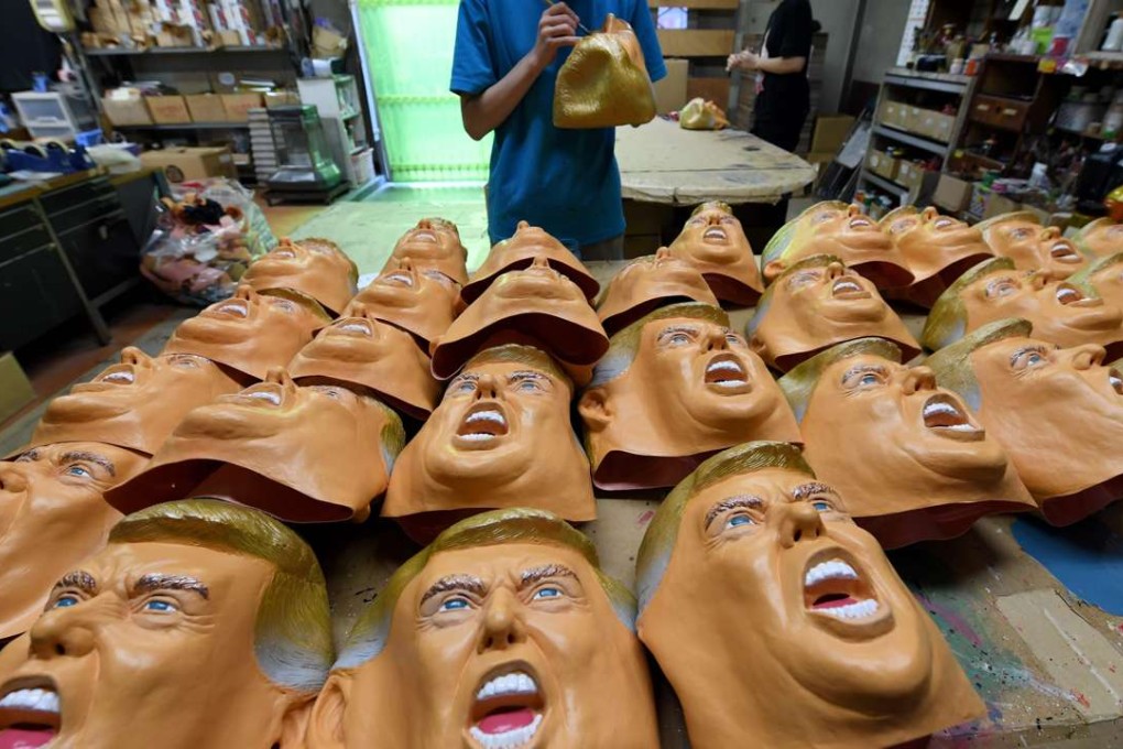Rubber masks of US President-elect Donald Trump. Stagnation and inequality have created the political discontent that Trump and Bernie Sanders, the two insurgent populists, tapped in their presidential campaigns. Photo: AFP